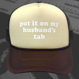 Put It On My Husband's Tab Trucker Hat