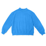 blue mock neck flat lay