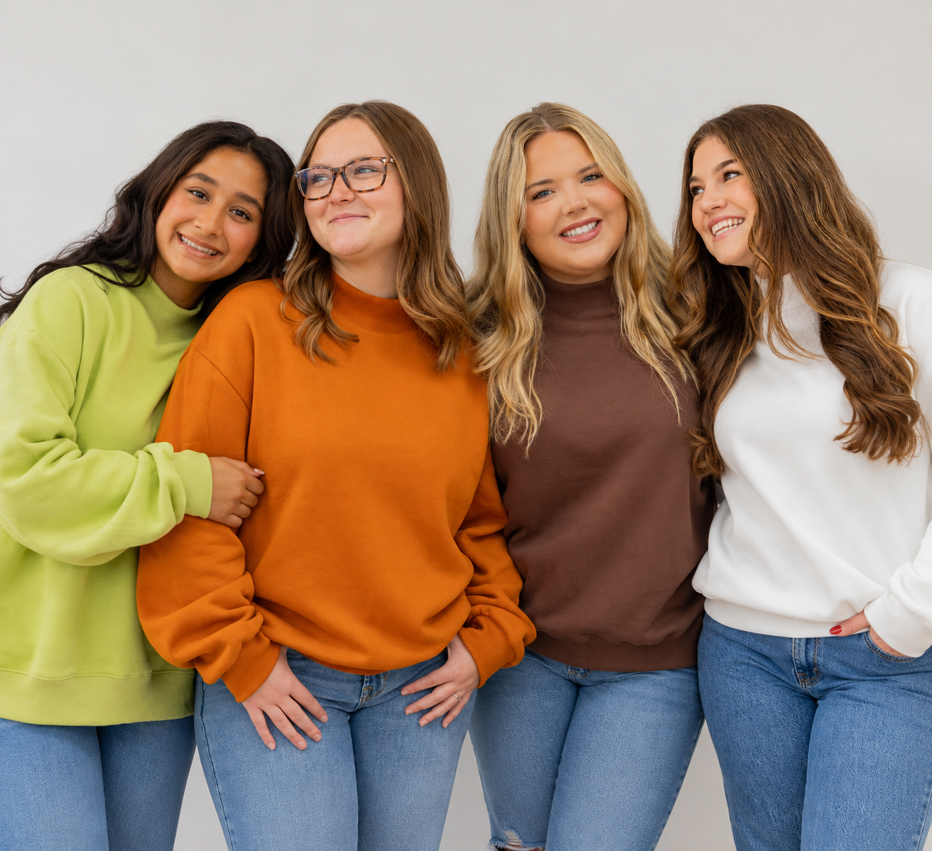 Model on left is wearing a matcha colored mock neck in size s/m model in pumpkin is wearing a size s/m model in espresso is wearing 2xl model in marshmallow is wearing a l/xl