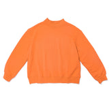 orange mock neck flat lay