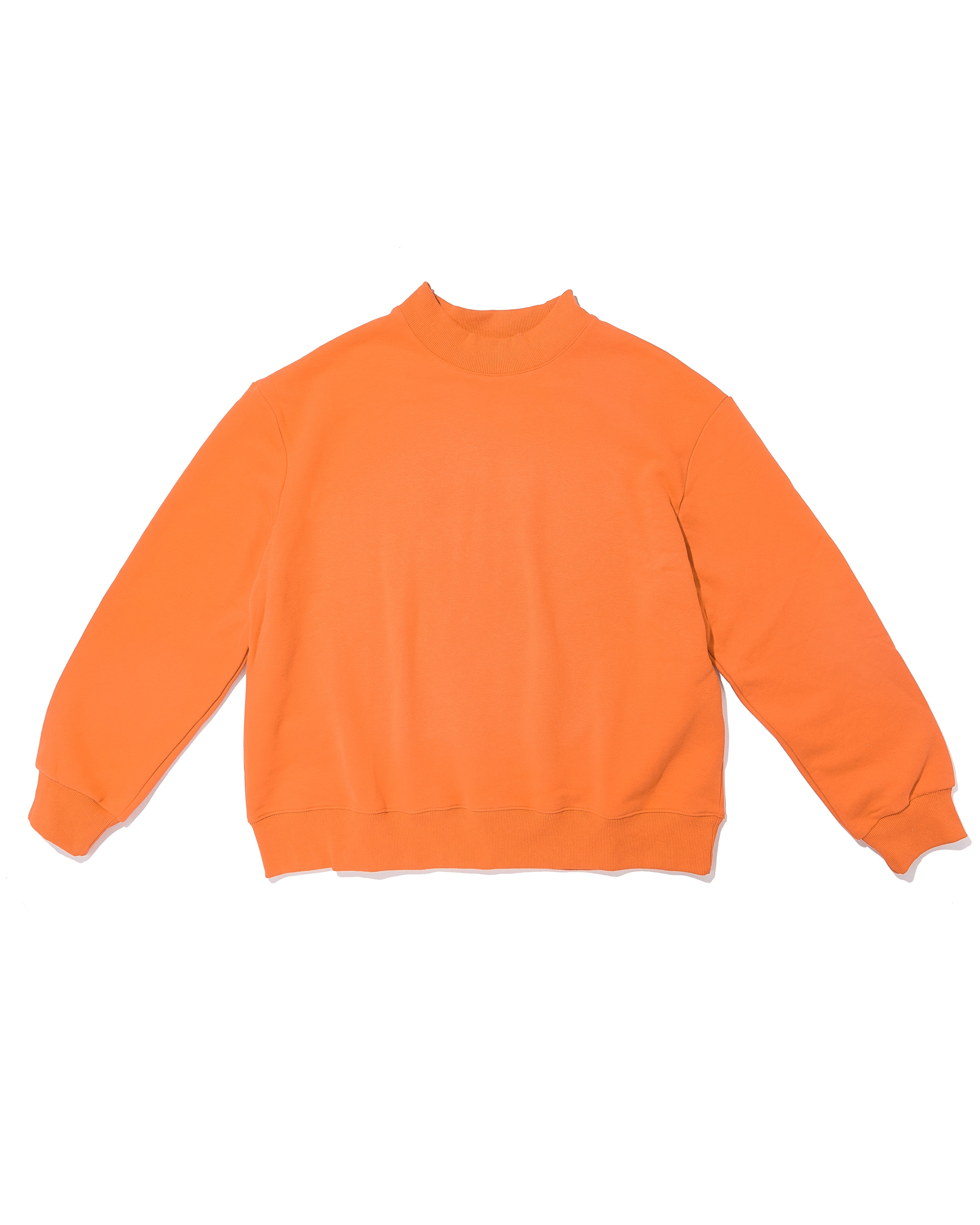 orange mock neck flat lay