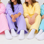 model in pink is wearing a 2xl, model in lilac is wearing a s/m, model in butter mis wearing a s/, ad model in blue is wearing l/xl