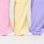 detail shot of hem of sweatpants in 3 colors pink, butter, and lilac