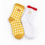 Chi Omega Gingham & Grace sorority sock set with gingham and white ruffle socks featuring embroidered Chi Omega lettering.