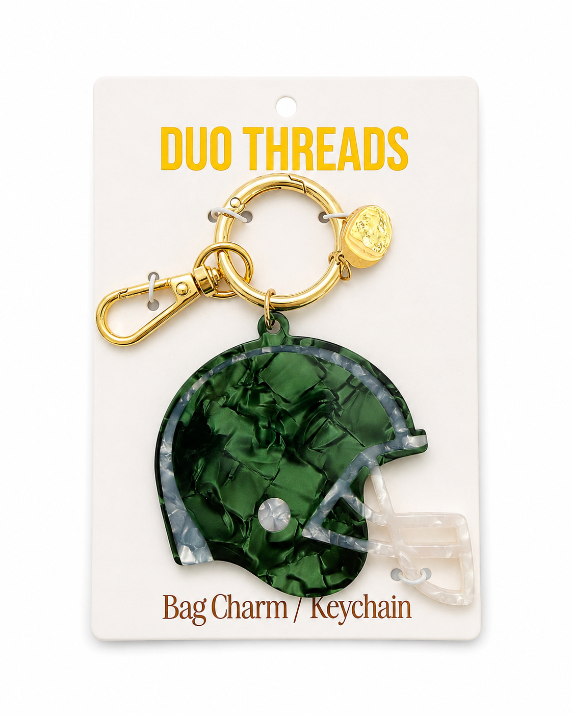 A green football helmet-shaped bag charm keychain with a gold clasp, displayed on a white card labeled 'DUO THREADS Bag Charm / Keychain'.