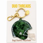 A green football helmet-shaped bag charm keychain with a gold clasp, displayed on a white card labeled 'DUO THREADS Bag Charm / Keychain'.