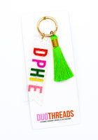 Load image into Gallery viewer, Delta Phi Epsilon Sparkle Tassel Key Fob
